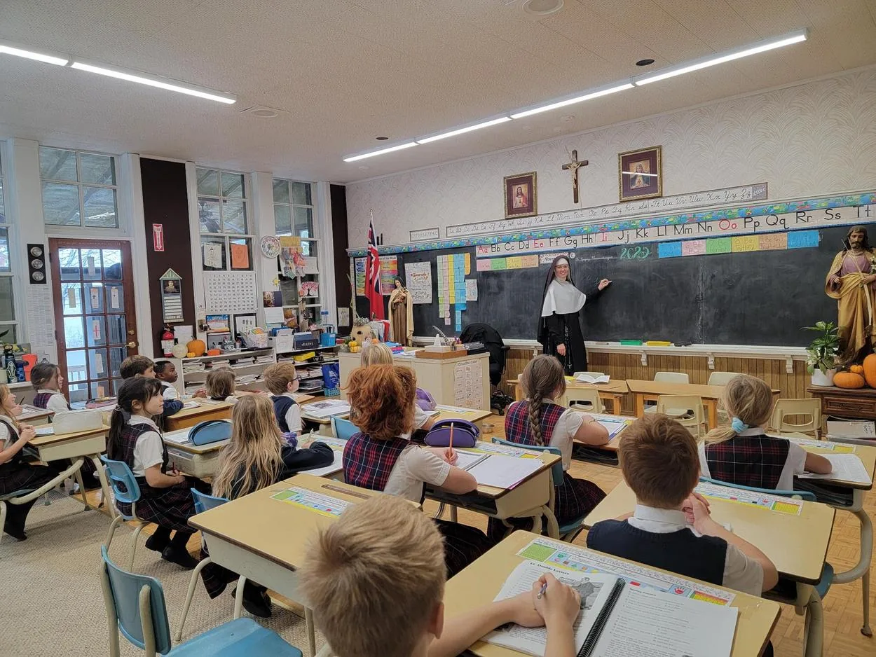 A Sister teaching in the classroom.