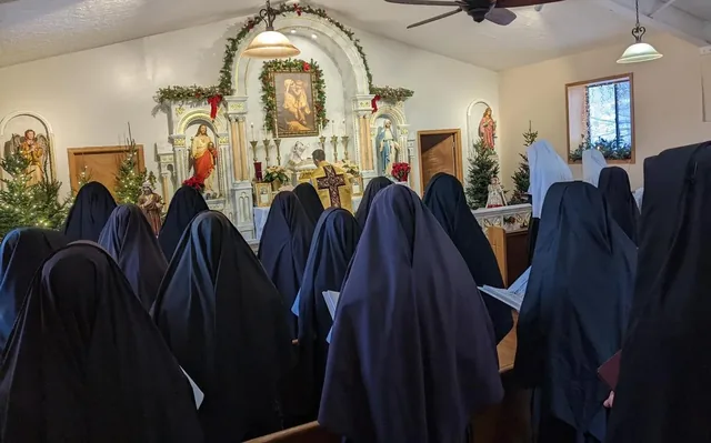 The Sisters assisting at Mass in the convent chapel.