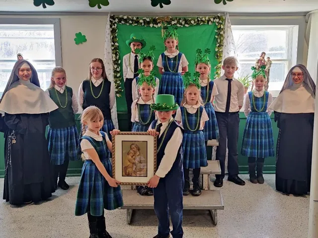 Students with their Sisters and a devotional image.