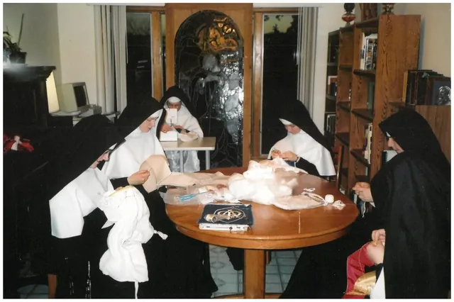 Sisters sewing together in community.