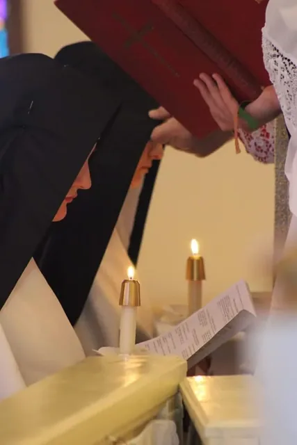 A Sister during the rite of religious profession.