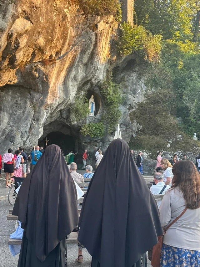 Sisters on pilgrimage at the Grotto of Lourdes.