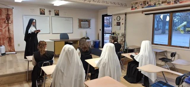 A Sister teaching a class to Sisters and candidates during religious formation.